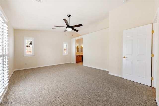 unfurnished bedroom with carpet flooring, baseboards, ceiling fan, and visible vents