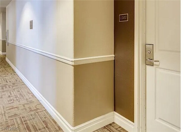 corridor featuring baseboards