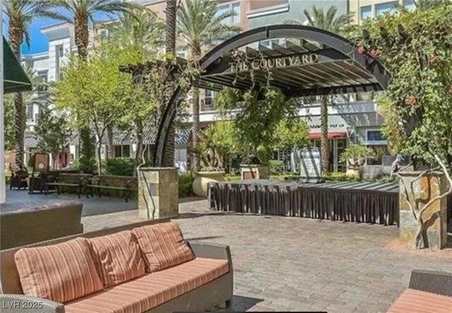 view of home's community with a patio and an outdoor living space