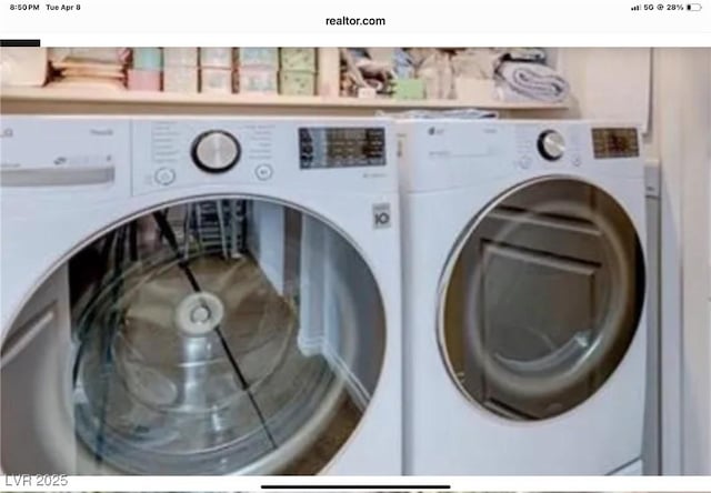 laundry room featuring washer and dryer and laundry area
