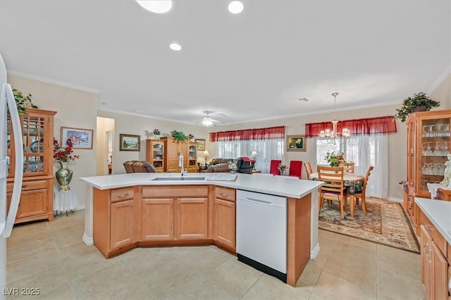 7741 Fruit Dove St, North Las Vegas, NV 89084 - kitchen featuring white dishwasher, a sink, light countertops, open floor plan, and a chandelier
