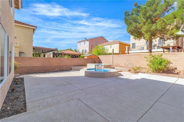 9967 Pipestone St, Las Vegas, NV 89141 - fenced backyard with a patio area, a residential view, and an outdoor hot tub