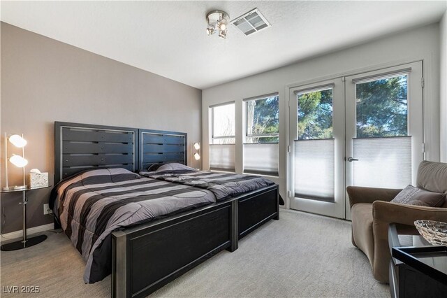 6923 Emerald Springs Ln, Las Vegas, NV 89113 - bedroom with light colored carpet and access to exterior