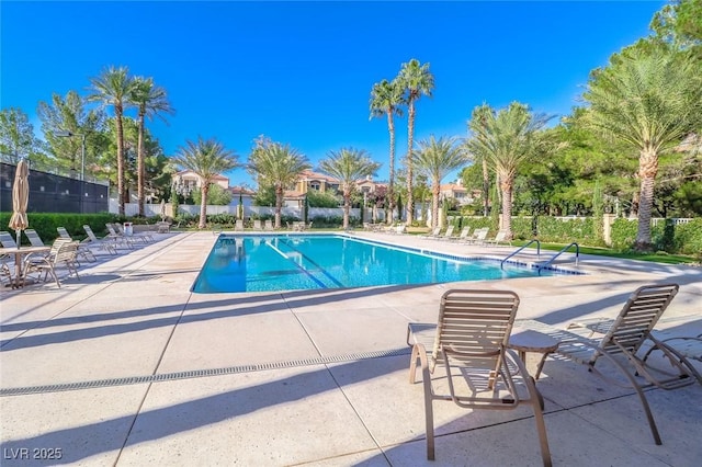 6923 Emerald Springs Ln, Las Vegas, NV 89113 - community pool with a patio