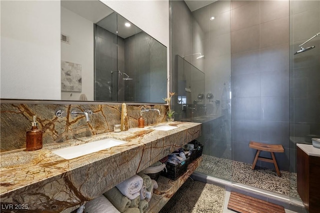 6923 Emerald Springs Ln, Las Vegas, NV 89113 - bathroom featuring a walk in shower, tasteful backsplash, and double vanity
