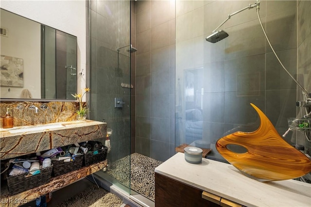 6923 Emerald Springs Ln, Las Vegas, NV 89113 - bathroom with a shower stall, vanity, and tile walls