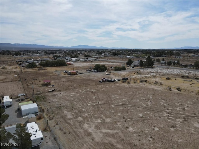 4861 Pahrump Valley Blvd, Pahrump, NV 89048 - birds eye view of property with a mountain view