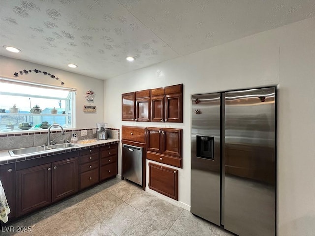 4861 Pahrump Valley Blvd, Pahrump, NV 89048 - kitchen with a sink, stainless steel appliances, tile countertops, recessed lighting, and dark brown cabinets