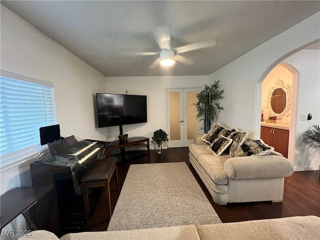 4861 Pahrump Valley Blvd, Pahrump, NV 89048 - living room with a ceiling fan, arched walkways, and dark wood finished floors