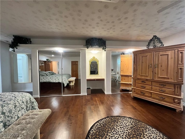 4861 Pahrump Valley Blvd, Pahrump, NV 89048 - bedroom featuring a closet, baseboards, and dark wood finished floors