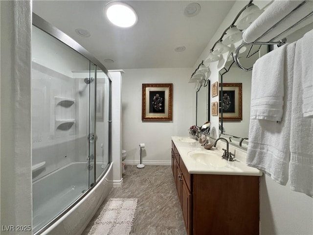 4861 Pahrump Valley Blvd, Pahrump, NV 89048 - full bath with shower / bath combination with glass door, toilet, a sink, baseboards, and double vanity