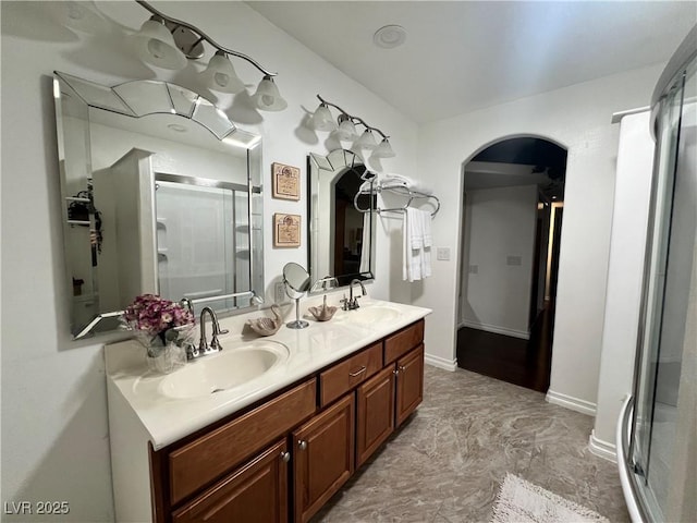 4861 Pahrump Valley Blvd, Pahrump, NV 89048 - bathroom with double vanity, a sink, baseboards, and a shower stall