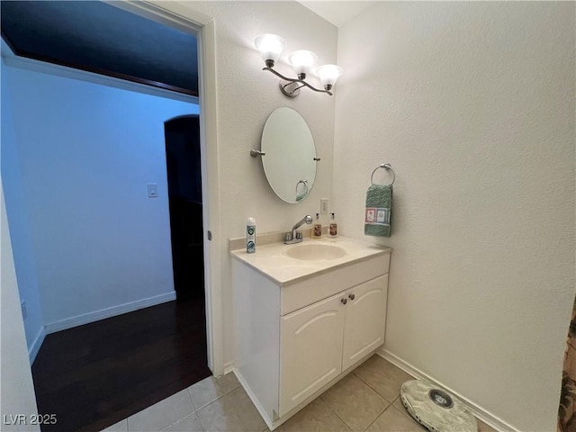 4861 Pahrump Valley Blvd, Pahrump, NV 89048 - bathroom with baseboards, tile patterned flooring, and vanity