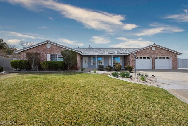 904 Hibiscus Ct, Henderson, NV 89011 - ranch-style home featuring a tile roof, a front yard, driveway, an attached garage, and brick siding