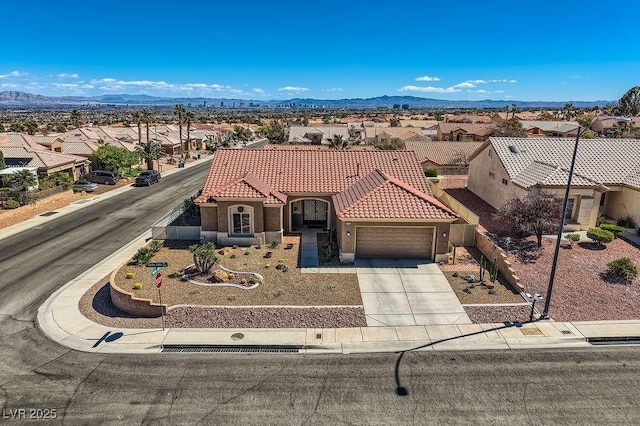 2736 Darby Falls Dr, Las Vegas, NV 89134 - mediterranean / spanish home with a garage, a residential view, a tile roof, and concrete driveway