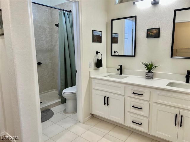 2736 Darby Falls Dr, Las Vegas, NV 89134 - full bathroom with tile patterned floors, toilet, a stall shower, and double vanity