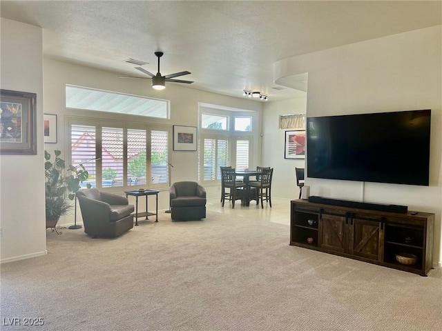 2736 Darby Falls Dr, Las Vegas, NV 89134 - carpeted living area with ceiling fan and baseboards