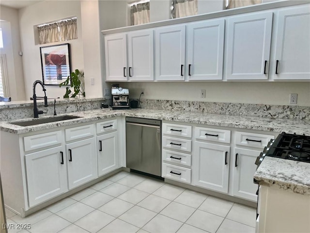 2736 Darby Falls Dr, Las Vegas, NV 89134 - kitchen with a sink, stainless steel dishwasher, a peninsula, white cabinets, and light stone countertops