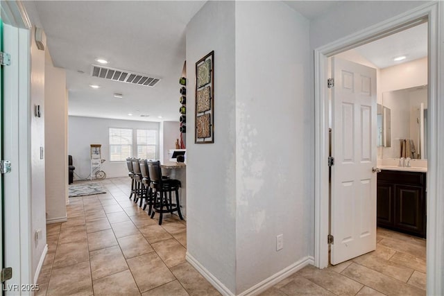 105 Campbelltown Ave, Henderson, NV 89015 - corridor featuring a sink, baseboards, visible vents, and light tile patterned floors