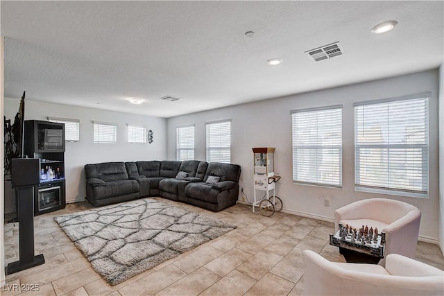 105 Campbelltown Ave, Henderson, NV 89015 - living room with light tile patterned flooring, baseboards, and visible vents