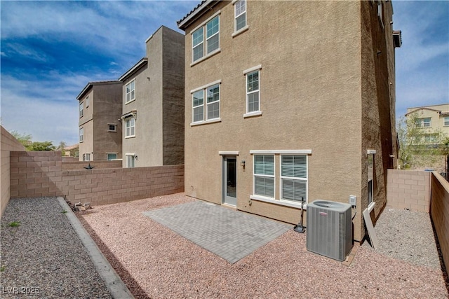 105 Campbelltown Ave, Henderson, NV 89015 - rear view of property featuring a fenced backyard, stucco siding, central air condition unit, and a patio area