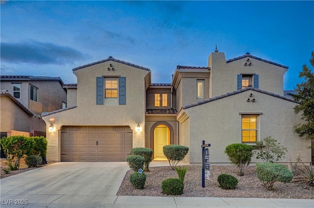 1004 Bluebird Ridge Ct, North Las Vegas, NV 89084 - view of front of house featuring a tiled roof, a garage, concrete driveway, and stucco siding