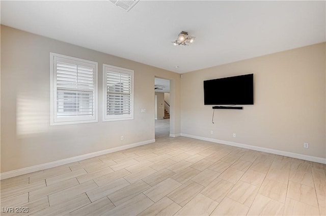 1004 Bluebird Ridge Ct, North Las Vegas, NV 89084 - unfurnished room with baseboards and stairway