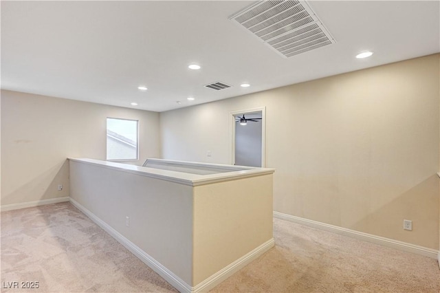1004 Bluebird Ridge Ct, North Las Vegas, NV 89084 - corridor featuring light carpet, recessed lighting, and an upstairs landing