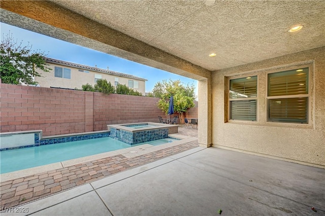 1004 Bluebird Ridge Ct, North Las Vegas, NV 89084 - view of swimming pool with a fenced backyard, a patio area, and a pool with connected hot tub