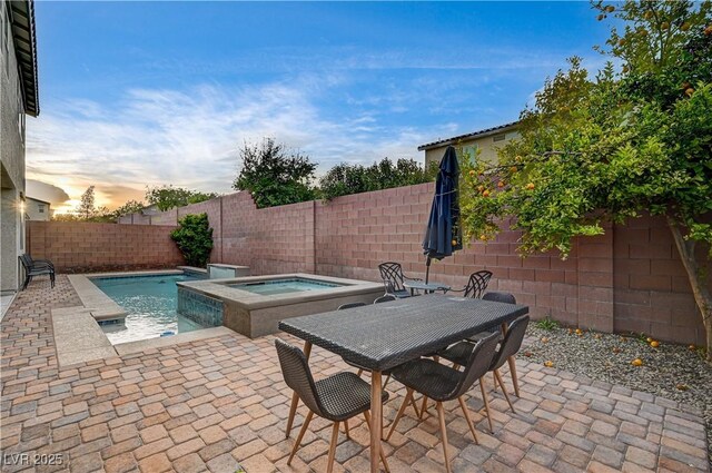 1004 Bluebird Ridge Ct, North Las Vegas, NV 89084 - view of swimming pool featuring an in-ground hot tub, a fenced backyard, and a patio