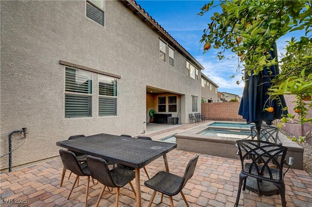 1004 Bluebird Ridge Ct, North Las Vegas, NV 89084 - view of patio with an in-ground hot tub and outdoor dining area