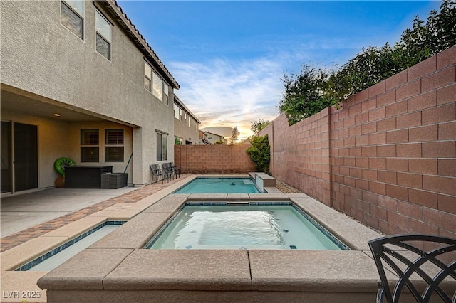 1004 Bluebird Ridge Ct, North Las Vegas, NV 89084 - view of swimming pool with an in-ground hot tub, a fenced backyard, and a patio