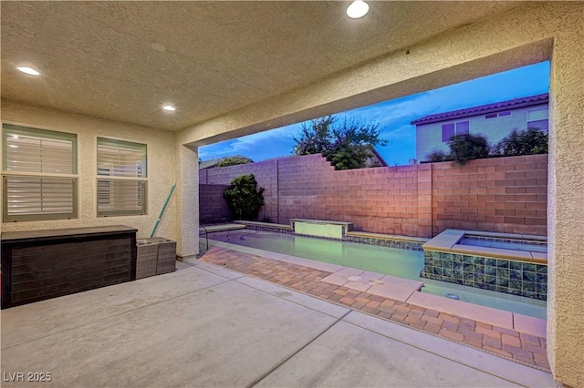 1004 Bluebird Ridge Ct, North Las Vegas, NV 89084 - fenced backyard with an in-ground hot tub and a patio