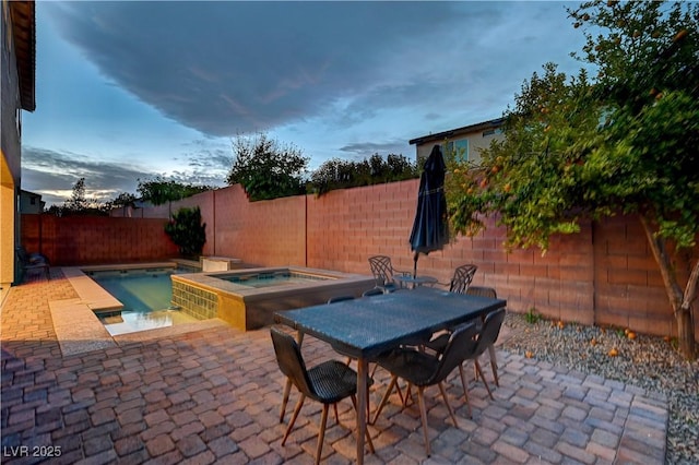 1004 Bluebird Ridge Ct, North Las Vegas, NV 89084 - fenced backyard with an in-ground hot tub and a patio area