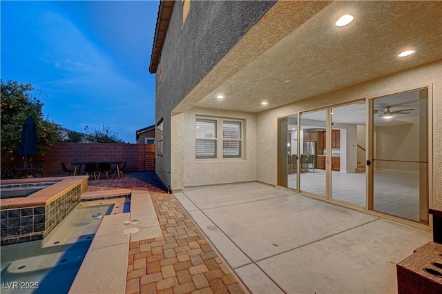 1004 Bluebird Ridge Ct, North Las Vegas, NV 89084 - fenced backyard featuring a patio, french doors, outdoor dining space, and a pool with connected hot tub