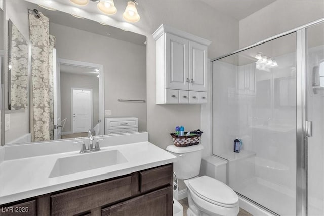 505 Punto Vallata Dr, Henderson, NV 89011 - bathroom featuring vanity, toilet, and a shower stall