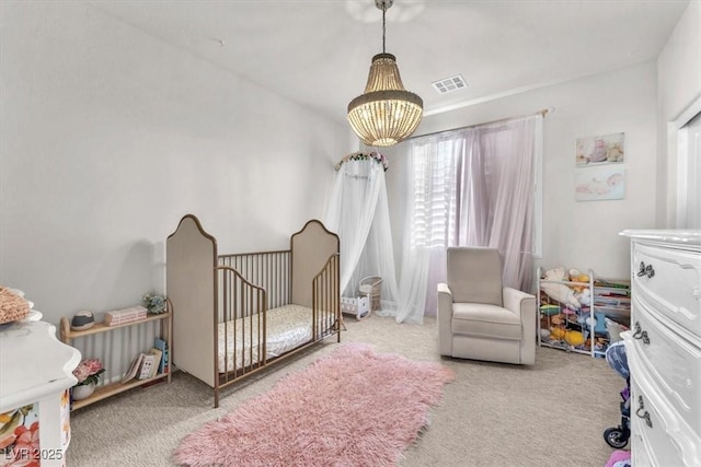 505 Punto Vallata Dr, Henderson, NV 89011 - carpeted bedroom with an inviting chandelier, a crib, and visible vents