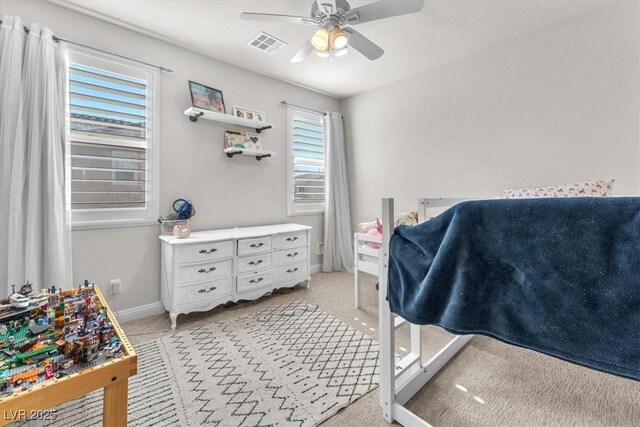 505 Punto Vallata Dr, Henderson, NV 89011 - bedroom featuring baseboards, visible vents, a ceiling fan, and light carpet