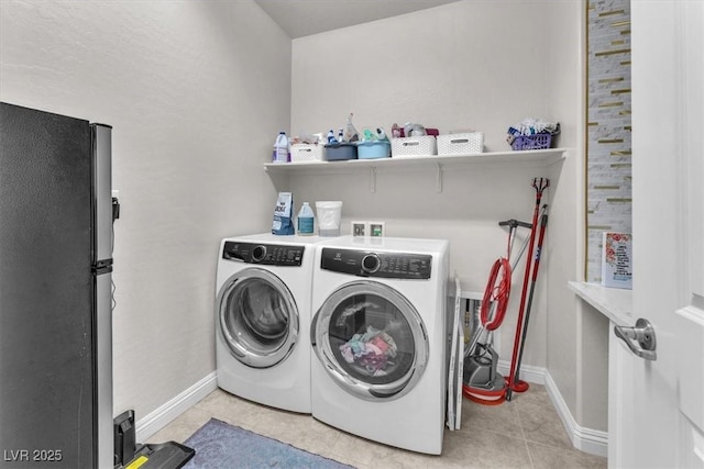 505 Punto Vallata Dr, Henderson, NV 89011 - washroom with light tile patterned floors, baseboards, laundry area, and washer and clothes dryer