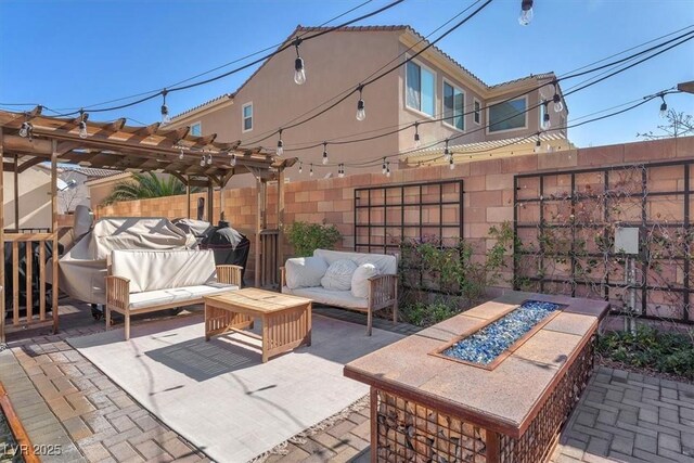 505 Punto Vallata Dr, Henderson, NV 89011 - view of patio / terrace with fence, an outdoor living space with a fire pit, and a pergola
