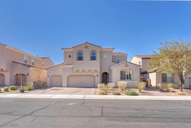 505 Punto Vallata Dr, Henderson, NV 89011 - mediterranean / spanish home with stucco siding, driveway, a garage, and a tile roof