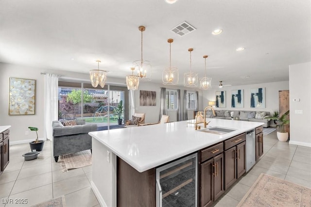 505 Punto Vallata Dr, Henderson, NV 89011 - kitchen with a sink, open floor plan, visible vents, and beverage cooler