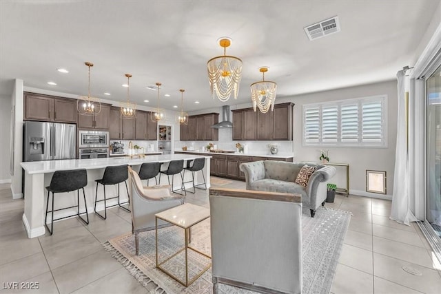 505 Punto Vallata Dr, Henderson, NV 89011 - living area with visible vents, a chandelier, baseboards, recessed lighting, and light tile patterned floors