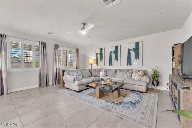 505 Punto Vallata Dr, Henderson, NV 89011 - living area featuring light tile patterned flooring, baseboards, ceiling fan, and visible vents