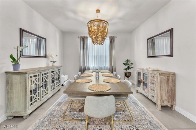 505 Punto Vallata Dr, Henderson, NV 89011 - dining space featuring baseboards, light tile patterned floors, and a notable chandelier