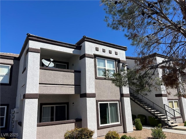 view of property featuring stairway