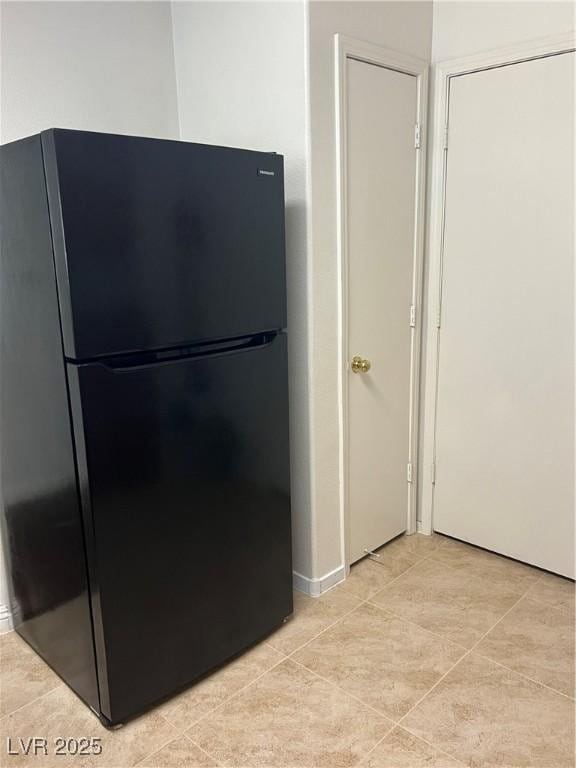 interior space featuring freestanding refrigerator