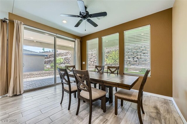 243 Sun Glaze Ave, Henderson, NV 89011 - dining room with light wood-style flooring, ceiling fan, and baseboards