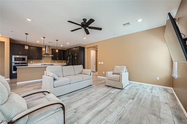243 Sun Glaze Ave, Henderson, NV 89011 - living area featuring baseboards, ceiling fan, light wood-style flooring, and recessed lighting