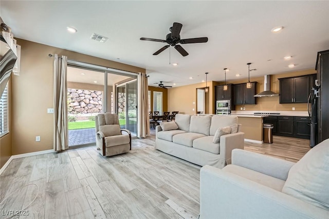243 Sun Glaze Ave, Henderson, NV 89011 - living room with ceiling fan, light wood-style floors, baseboards, and recessed lighting
